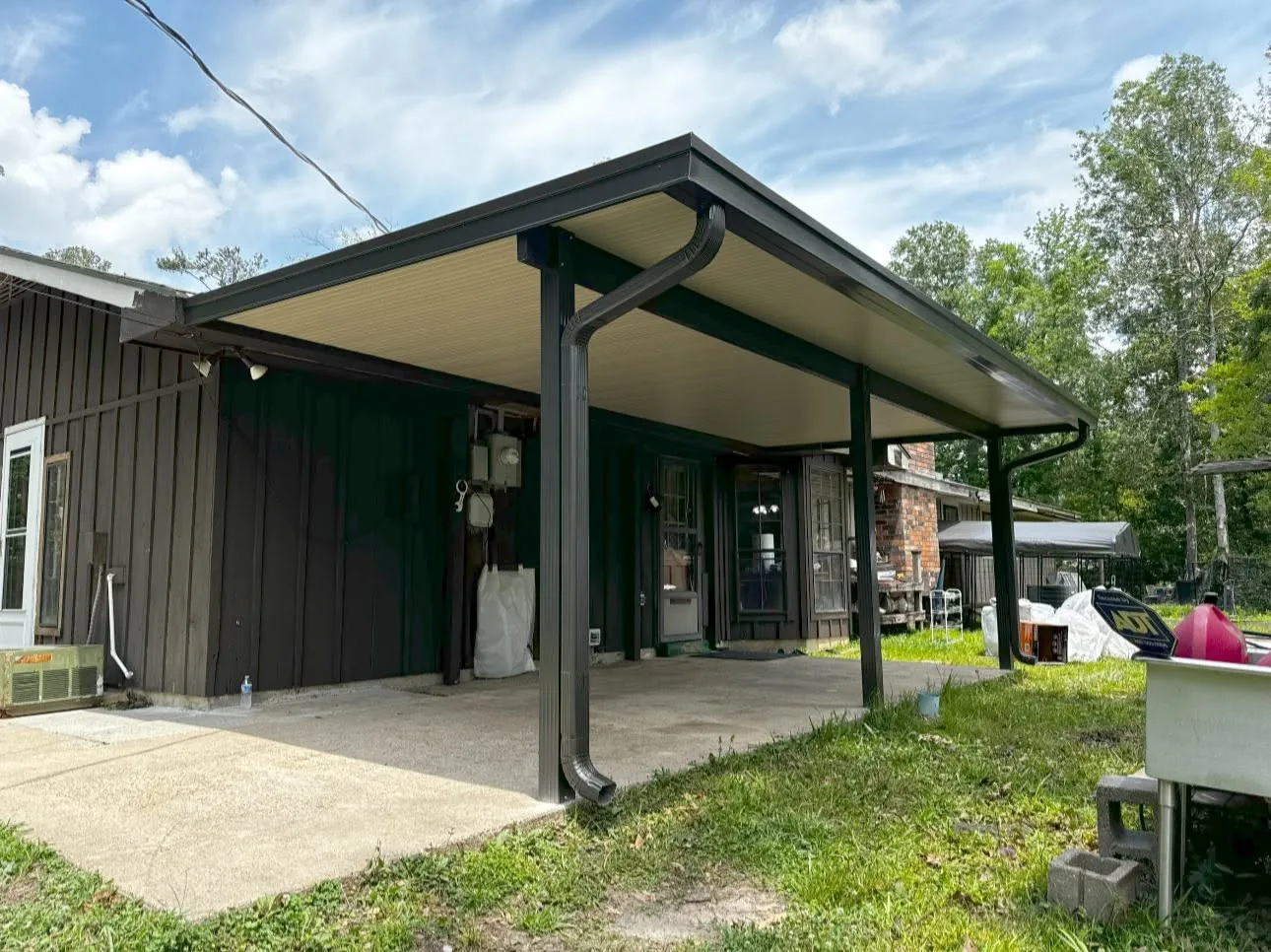 Gabled patio cover that matches the roofline of a Baton Rouge area home