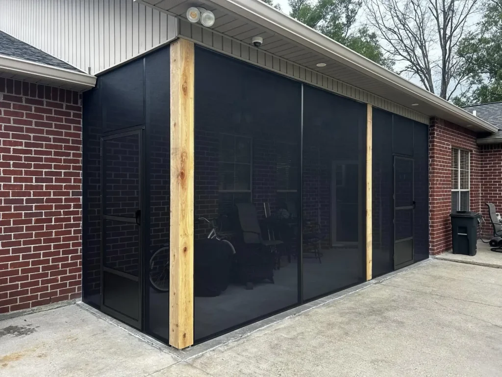 tiger town black screen room cedar posts brick home