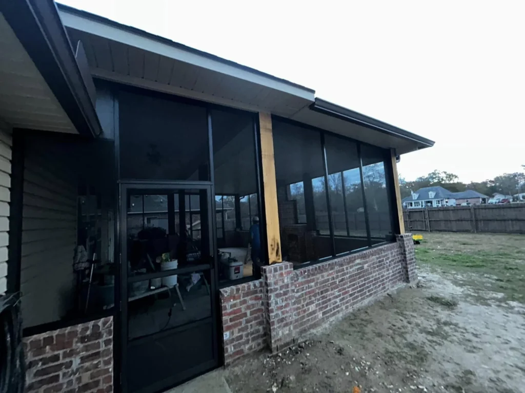tiger town black screen room cedar posts brick knee wall dusk