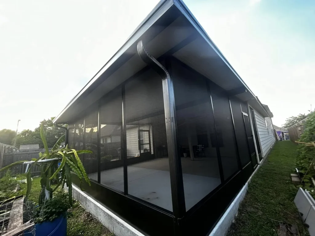 tiger town black screen room gabled white siding home garden