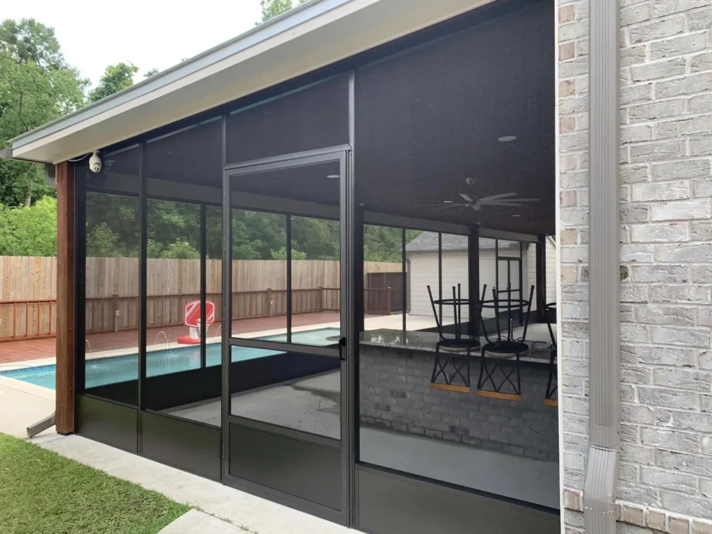 tiger town black screen room white brick home pool view