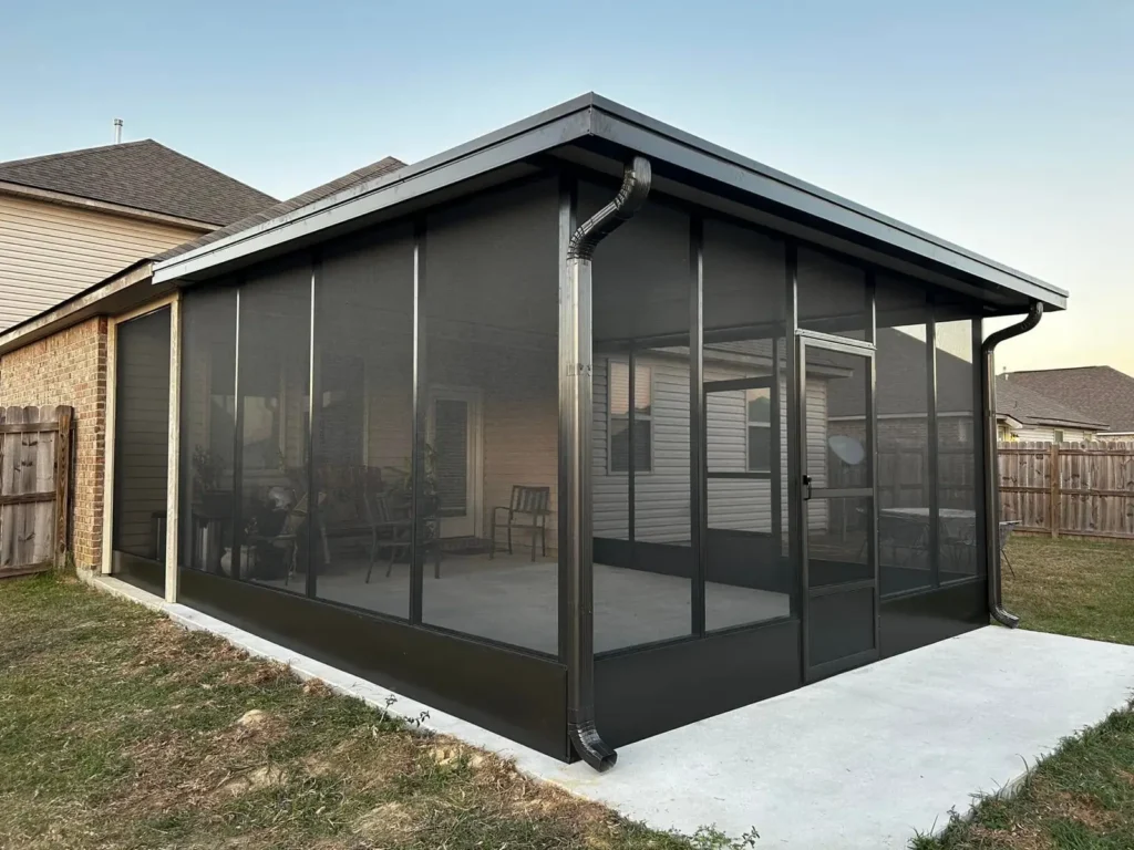 tiger town bronze screen room brick home dusk exterior