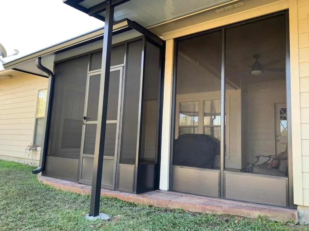 tiger town bronze screen room tan siding home corner