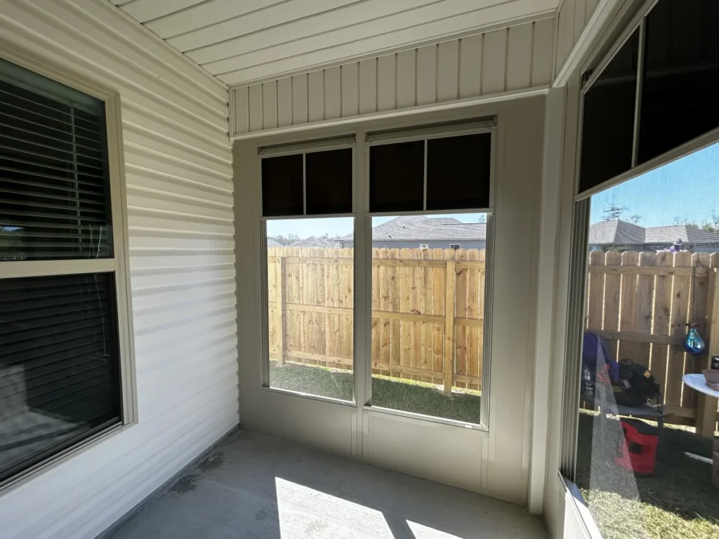 tiger town construction eze breeze room interior corner window tan frame cedar fence