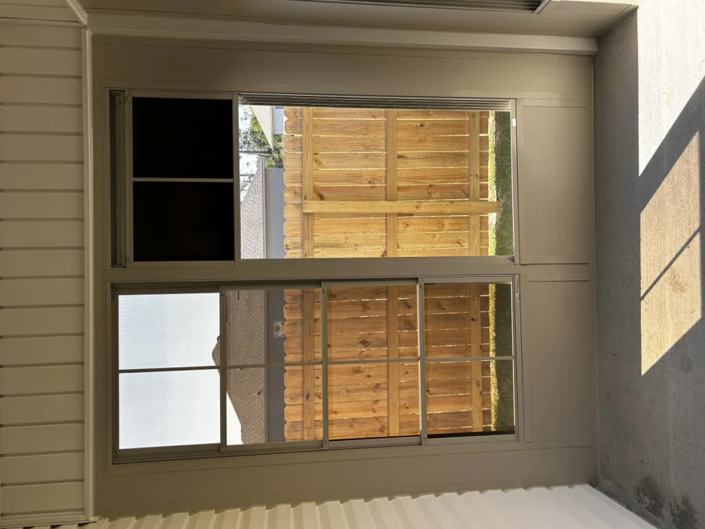 tiger town construction eze breeze room interior tan frame sliding windows cedar fence