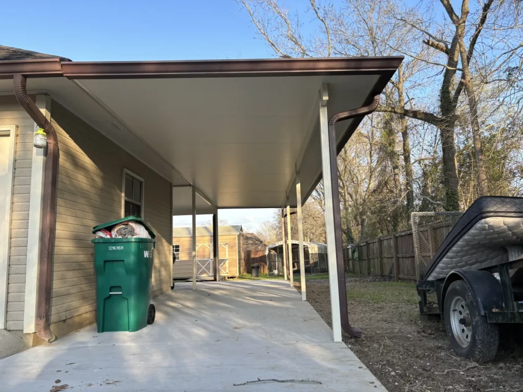 tiger town construction insulated patio cover bronze frame carport trash bin side yard