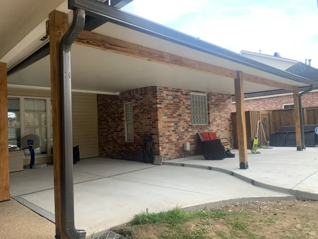 tiger town construction insulated patio cover cedar column brick wall glass block