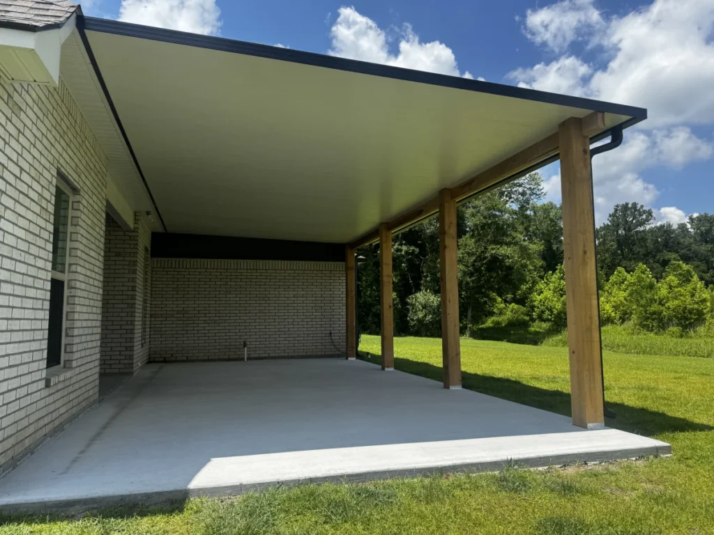 tiger town construction insulated patio cover cedar columns white brick wide lawn