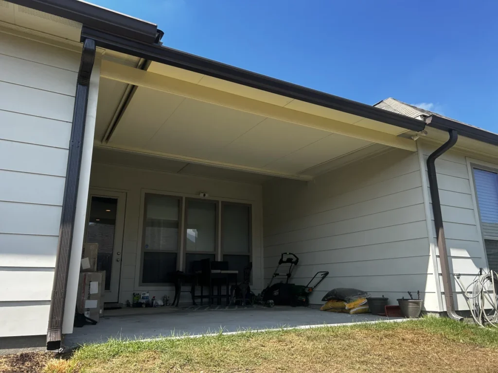 tiger town construction insulated patio cover tan frame low angle blue sky