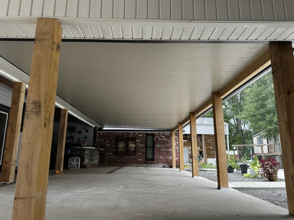 tiger town construction insulated patio cover underside cedar columns brick wall garden
