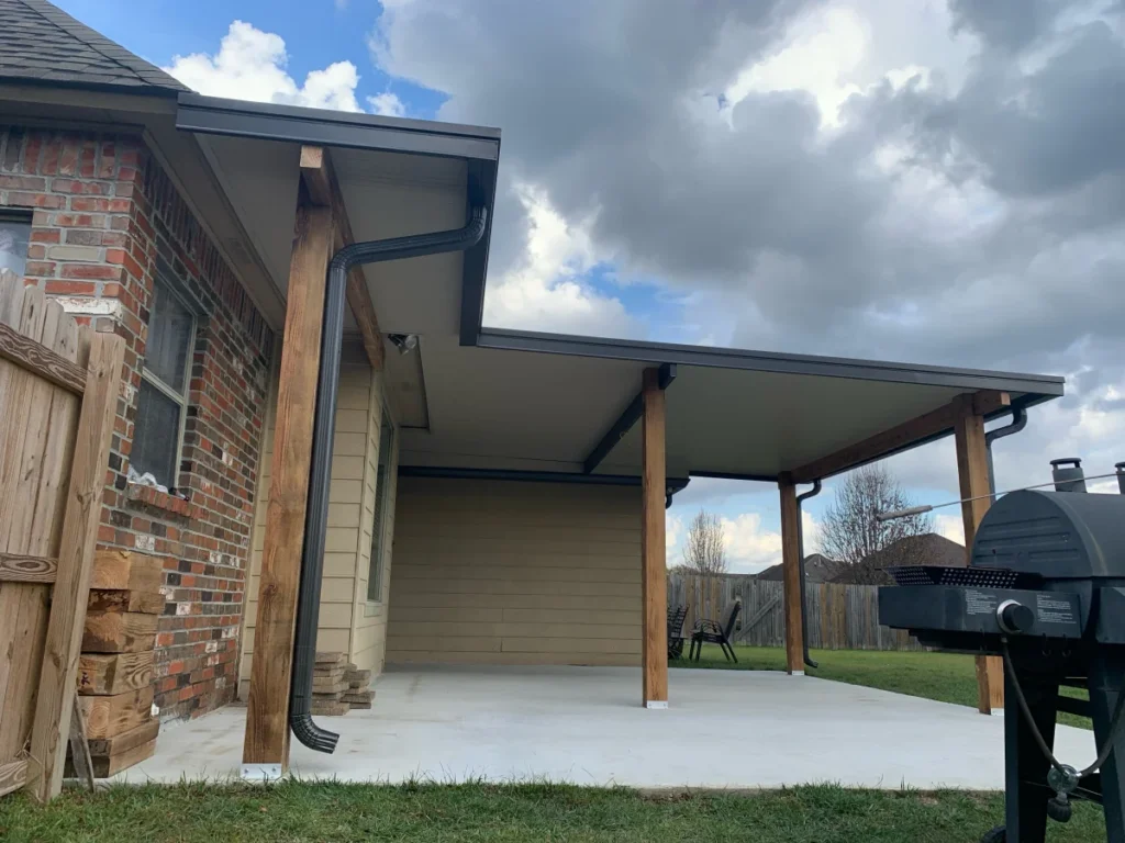 tiger town construction non insulated patio cover cedar columns brick home grill cloudy