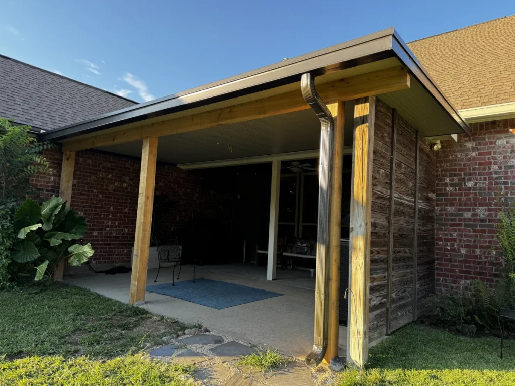 tiger town construction non insulated patio cover cedar columns red brick home board batten