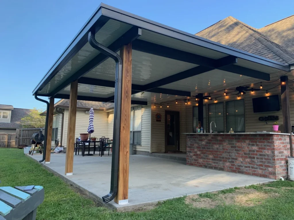 tiger town construction non insulated patio cover cedar columns string lights outdoor kitchen
