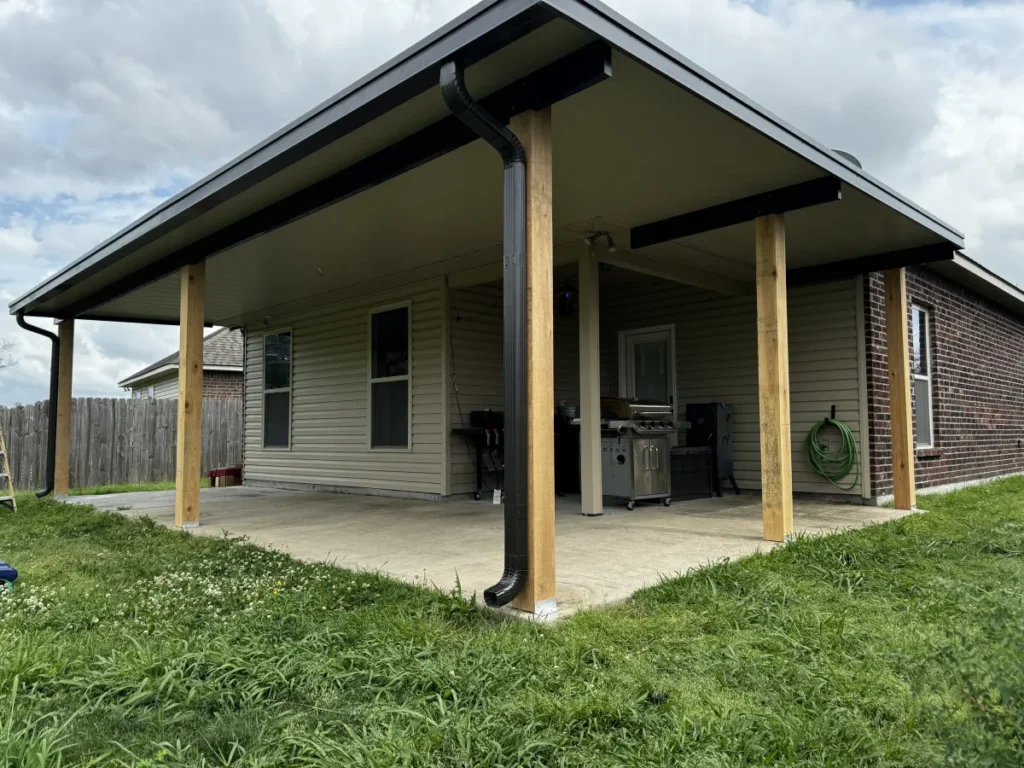tiger town construction non insulated patio cover cedar columns tan home outdoor kitchen cloudy
